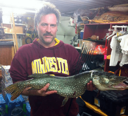 Eleven and a half pound northern pike caught in a Little Winnie Resort Darkhouse.